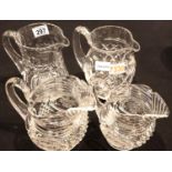 Two large Stuart Crystal pitchers and two graduated cut and etched jugs. Not available for in-