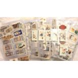 Approximately 2000 cigarette cards in card pockets. P&P Group 2 (£18+VAT for the first lot and £3+