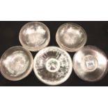 A set of Edwardian glass dessert bowls, sixteen in total, each with a star-cut base, with further
