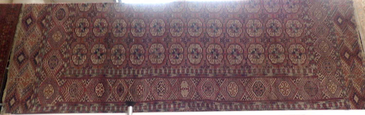 An early 20th century Tekke Turkman style rug, fringed, 296 x 220 cm. Not available for in-house P&