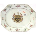 A large early 19th century painted meat platter, The centre with gilt and enamelled armorial, with