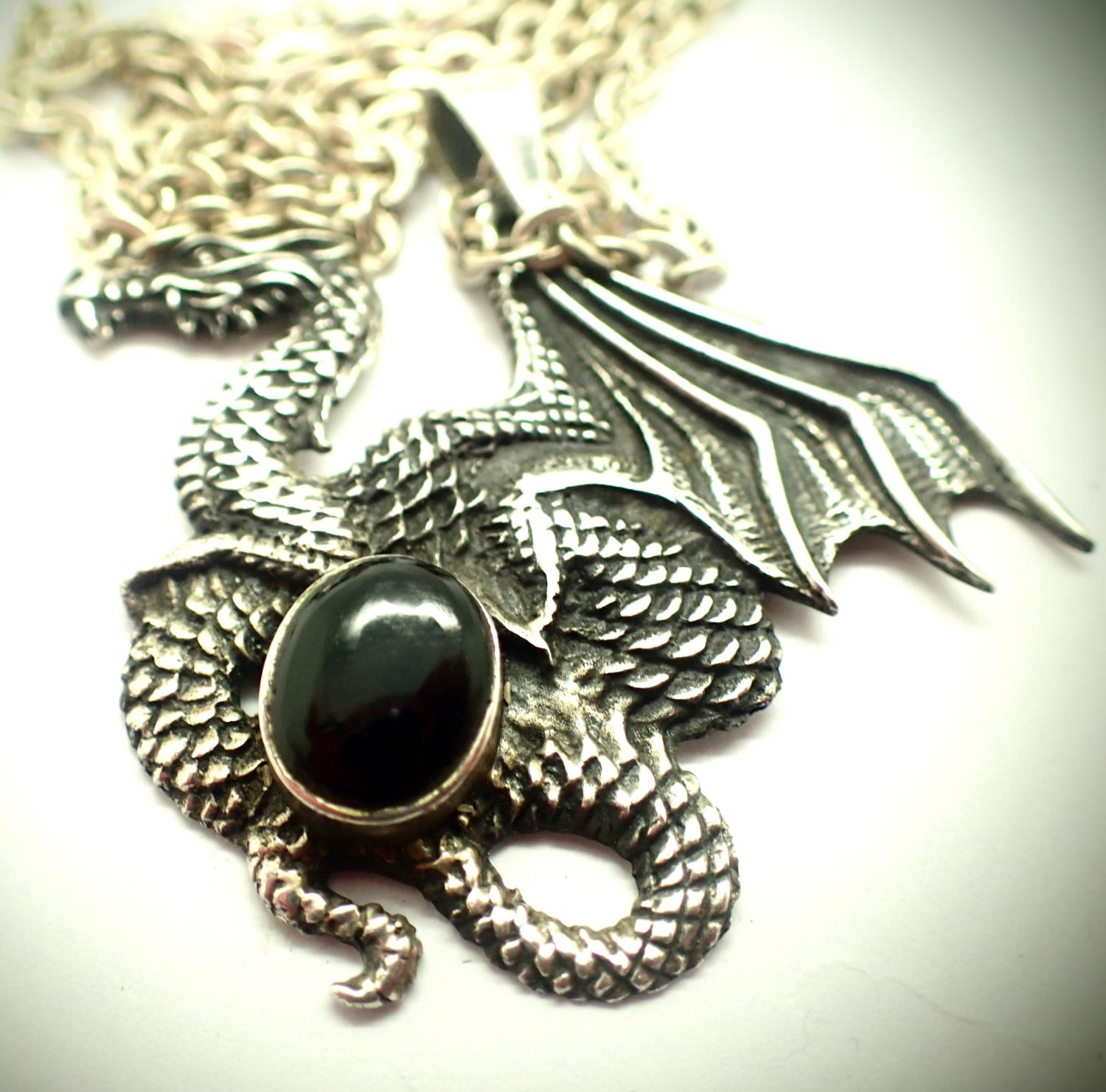 Silver dragon pendant with black onyx on a silver chain. P&P Group 1 (£14+VAT for the first lot