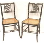 Pair of Arts and Crafts bedroom chairs each with Bergere seat and pierced back nest. Not available