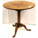George III walnut circular occasional table with tilting top and raised on a tripod base, D: 71, H: