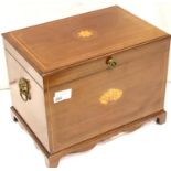An Edwardian inlaid mahogany cellarette with hinged cover and shaped bracket supports, 56 x 38 x