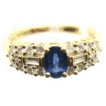 A Contemporary 18ct gold sapphire and diamond set cocktail ring, the single central oval sapphire of