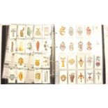 Approximately 2000 cigarette cards in an album. P&P Group 2 (£18+VAT for the first lot and £3+VAT