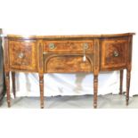 George III inlaid and crossbanded buffet in walnut and mahogany of four drawers raised on turned