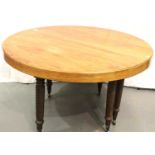 *** WITHDRAWN*** A circular walnut extending dining table raised on six twist supports, D: 130 cm.