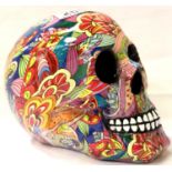 Pop culture decorated cast skull, H: 14 cm. P&P Group 1 (£14+VAT for the first lot and £1+VAT for