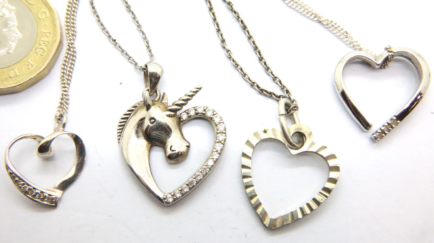 Four silver heart necklaces, two stone set. P&P Group 1 (£14+VAT for the first lot and £1+VAT for