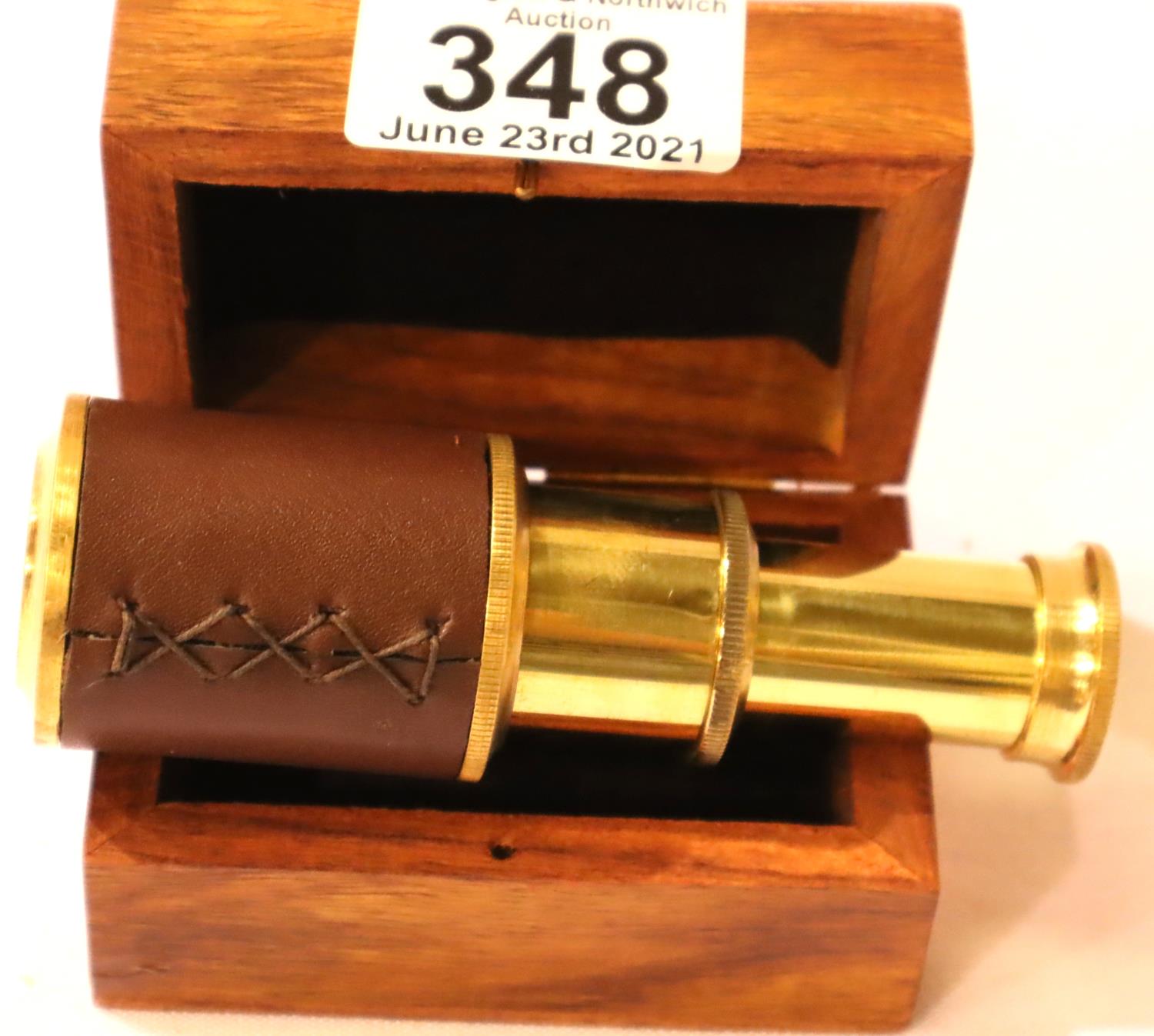 Boxed small brass and leather two draw telescope, extended, L: 10 cm. P&P Group 1 (£14+VAT for the