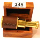 Boxed small brass and leather two draw telescope, extended, L: 10 cm. P&P Group 1 (£14+VAT for the