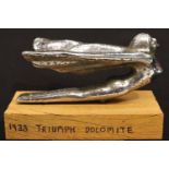 Car bonnet mascot; 1938 Triumph Dolomite, L: 12 cm. P&P Group 1 (£14+VAT for the first lot and £1+