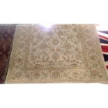 Contemporary floor rug with design against a cream ground, 220 x 165 cm. Not available for in-