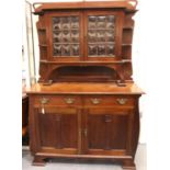 A 19th century Art Nouveau mahogany dresser comprising a base of cupboard and drawers, top section