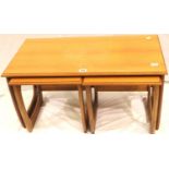 Mid 20th century teak nest of three tables in the G Plan style, largest 90 x 48 cm. Not available