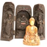 A carved hardwood seated Buddhist deity with gilt face, H: 11 cm and a contemporary trifold prayer