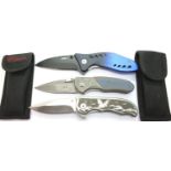 Box of three modern folding knives, two with canvas pockets. P&P Group 2 (£18+VAT for the first