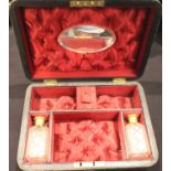 Victorian leather dressing case with fitted interior, including mirror, containing two perfume