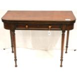 A Regency period mahogany tea table with fold-over top, molded edge with single drawer, raised on