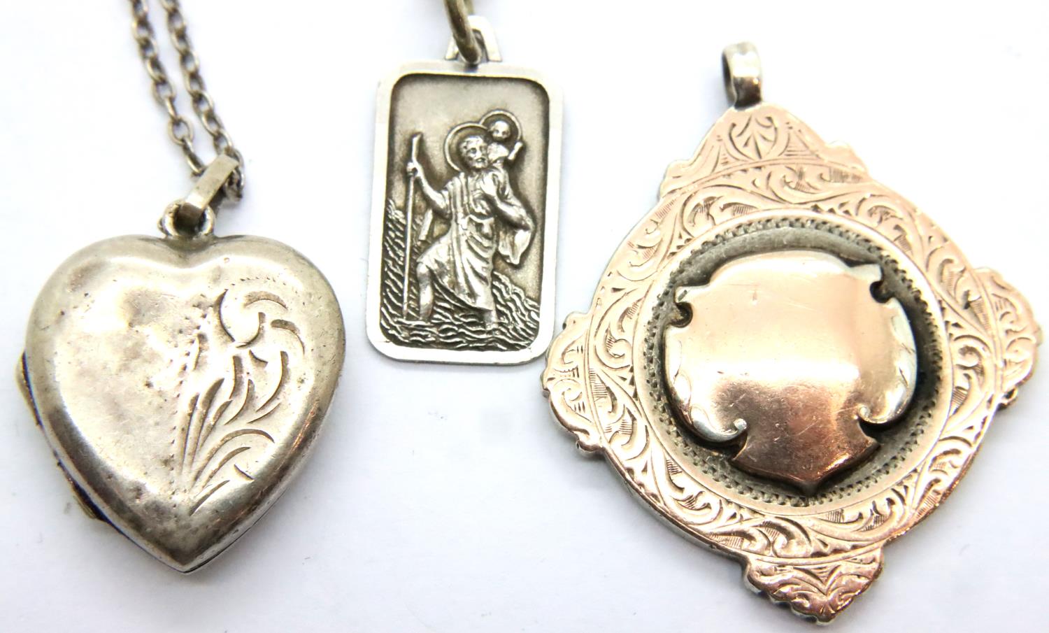925 silver St Christopher pendant necklace, a vintage heart locket and a gold washed silver fob,