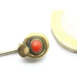 Coral set pinchbeck stick pin, L: 70 mm. P&P Group 1 (£14+VAT for the first lot and £1+VAT for