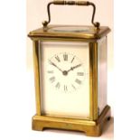 French brass carriage clock with key, H: 12 cm. P&P Group 3 (£25+VAT for the first lot and £5+VAT