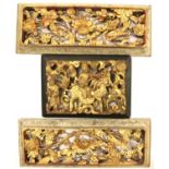 Two carved wood gilded Chinese panels 40 x 15 cm and a further similar item. Not available for in-