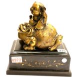 Oriental bronzed Buddha riding a toad on a raised marble base, H: 27 cm. P&P Group 3 (£25+VAT for