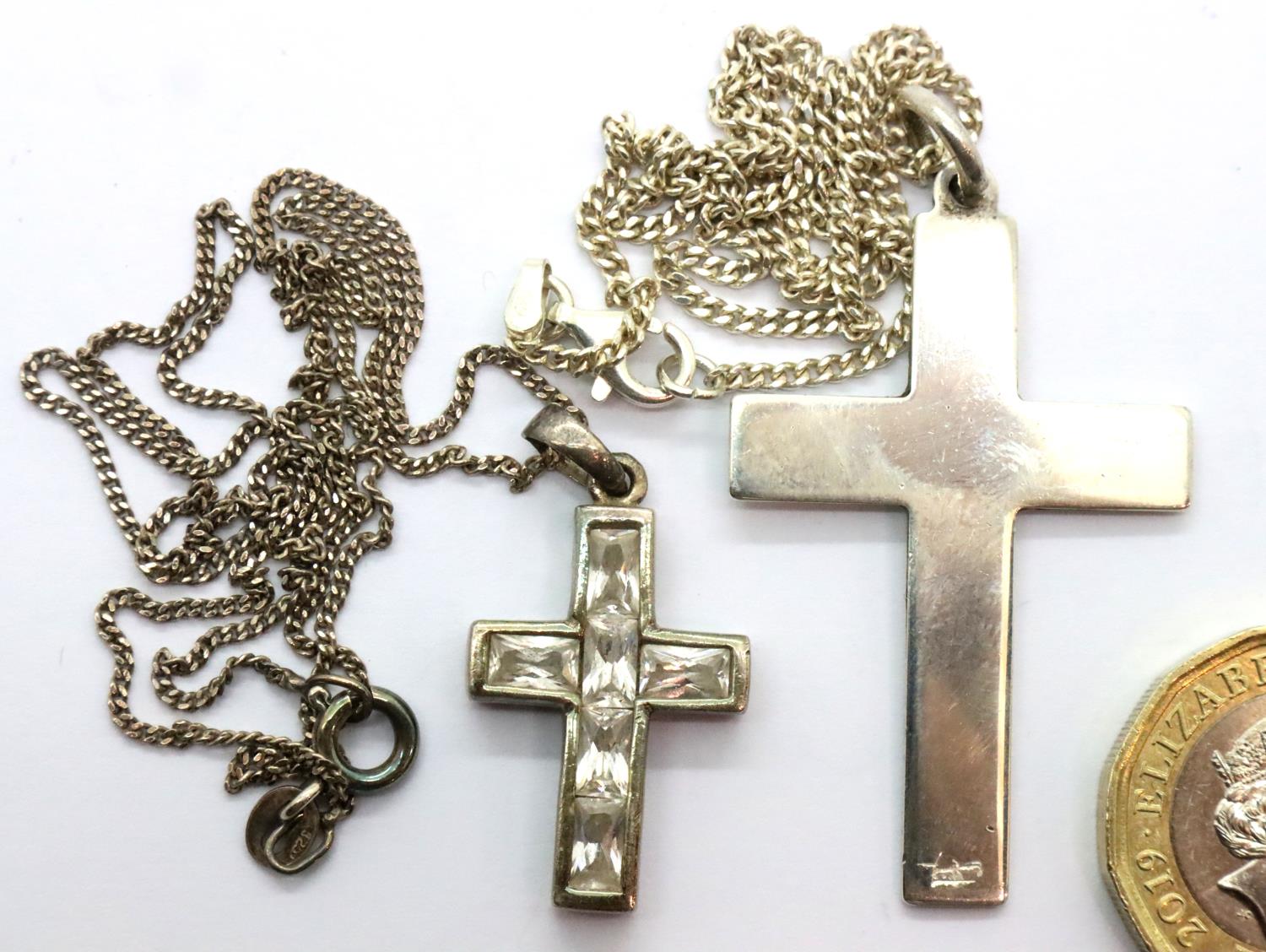 Two silver crosses and chains, one stone set. P&P Group 1 (£14+VAT for the first lot and £1+VAT