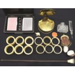 Twelve various 19th Century ivory napkin rings, most numbered, a back scratcher and a set of playing