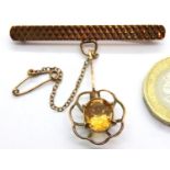 9ct gold bar brooch with cage set citrine solitaire, 5.9g. P&P Group 1 (£14+VAT for the first lot