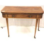 A George III walnut tea table with fold-over top, crossbanded with single drawer and raised on