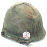 Vietnam War period US M1 helmet with fibre and canvas liner and reversible Mitch-Duck Hunter