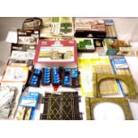 Approximately twenty plastic/card building kits, accessory packs etc and tunnel portals, switches,