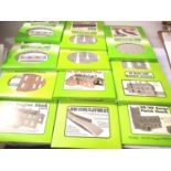 Eleven Metcalfe card building OO scale kits; church, platform x2, retaining wall x2, engine shed x2,