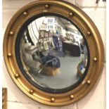 Gilt framed oval bullseye mirror, D: 47 cm. Not available for in-house P&P, contact Paul O'Hea at