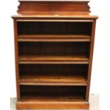 A 19th Century mahogany bookcase having four hinged dust covers, upstand and plate rack, 81 x 30 x