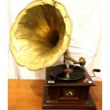 A 20th Century oak cased HMV gramophone with brass trumpet, working at lotting. Not available for
