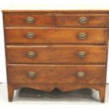 A Regency inlaid walnut chest of two short above three long drawers, raised on shaped bracket