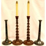 Pair of early 20th Century oak twist candlesticks with electric conversion and a pair of turned