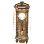 Victorian Vienna wall clock inlaid with walnut decorated with carved columns, white dial with