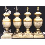 Set of four 20th Century turned, painted and gilt wood table lamp bases, overall H: 50 cm. Not