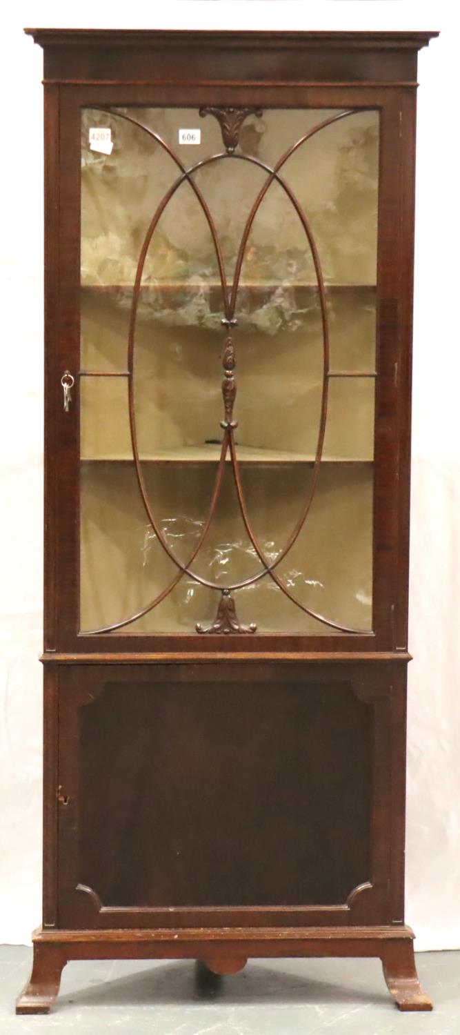 An Edwardian corner cupboard, free standing with single glazed display door, two shelves and