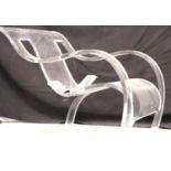 A mid 20th Century clear perspex armchair, one leg requires attention but is present. Not