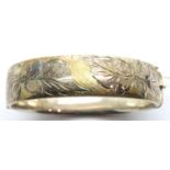 Hallmarked silver snap bangle with gilt and incised decoration, 33g. P&P Group 1 (£14+VAT for the