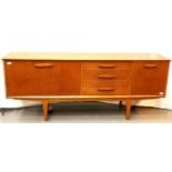 Jentique mid 20th Century asymmetrical teak sideboard of cupboards and drawers. Not available for