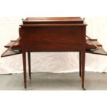 Jeffrey Sons and Co, Northampton; an Edwardian inlaid mahogany drinks cabinet having two drop-down