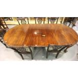 An early 20th Century mahogany oval extending dining table, wind-out with two leaves with a set of